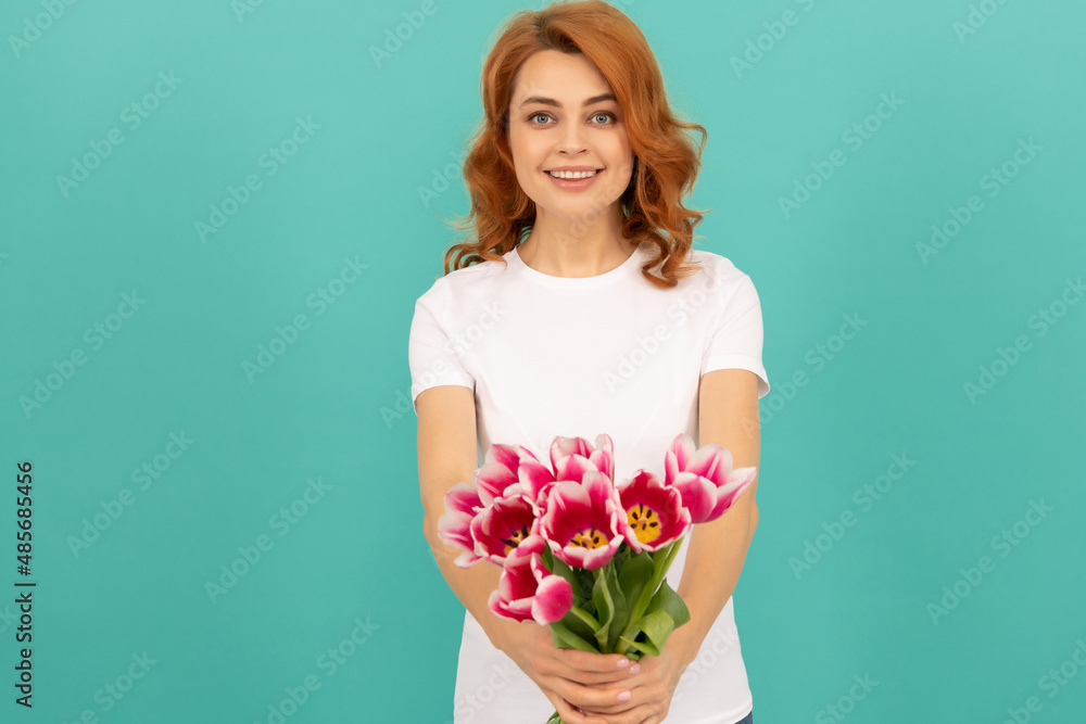 glad woman with tulip flower bouquet on blue background glad woman with tulip flower bouquet on blue background