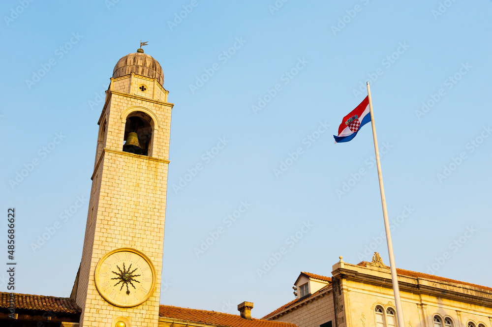 Obraz premium Photo of Dubrovnik City Bell Tower and the Croatian flag, Dubrovnik, Dalmatia, Croatia