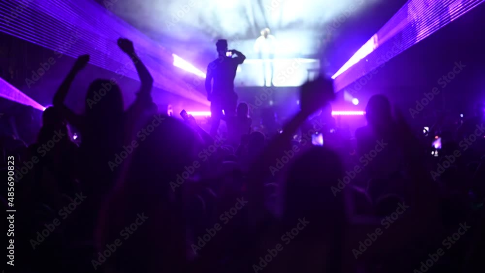 custom made wallpaper toronto digitalCheering crowd on a concert in front of bright colorful stage lights