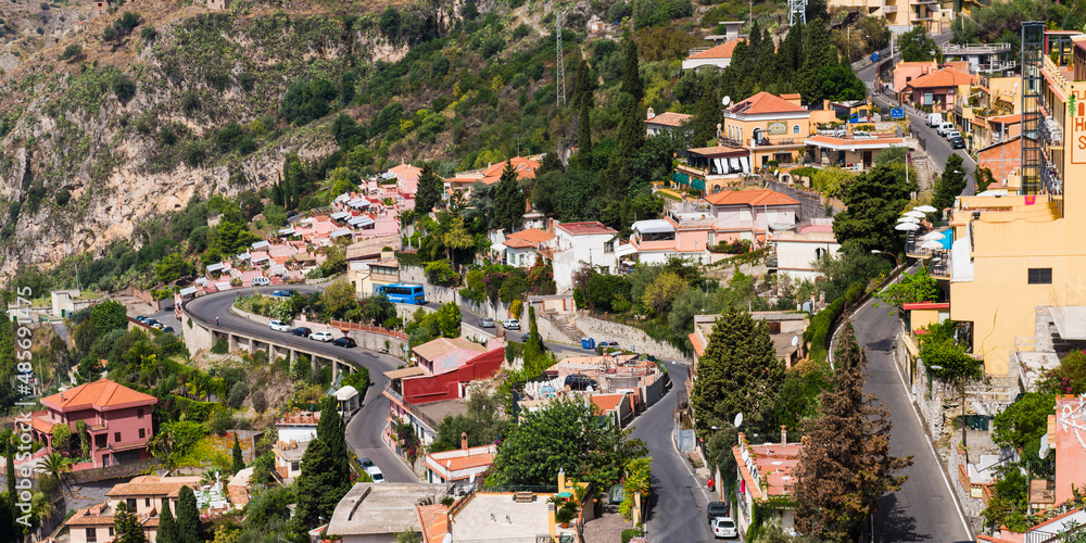 Fototapeta premium Taormina, panoramic photo of windy roads winding up through Taormina towards Castelmola, Sicily, Italy, Europe