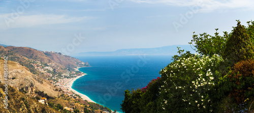 Fototapeta Naklejka Na Ścianę i Meble -  Panoramic photo of Letojanni Beach and Mazzeo Beach and the Ionian Sea (part of the Mediterranean Sea) seen from Taormina, East Coast of Sicily, Italy, Europe