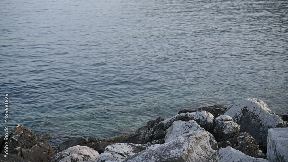 Stones on the shore of a lake or a sea and ocean Stones on the shore of a lake or a sea and ocean
