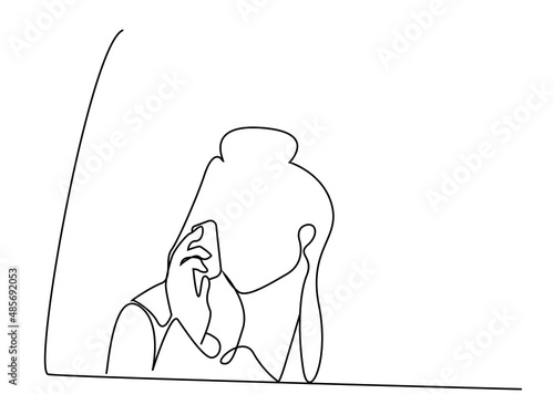 a woman traveling in a vehicle is standing near the window and talking on the phone