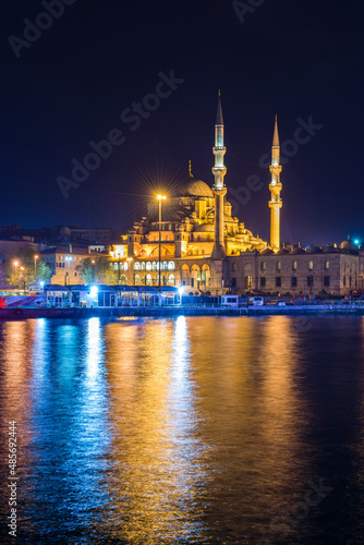 Reflection of New Mosque (New Valide Sultan Mosque) in the Golden Horn at night, Istanbul, Turkey, Eastern Europe
