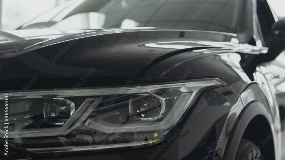 New modern automobile. Tracking shot presentation of brand new suv car at dealership auto salon New modern automobile. Tracking shot presentation of brand new suv car at dealership auto salon