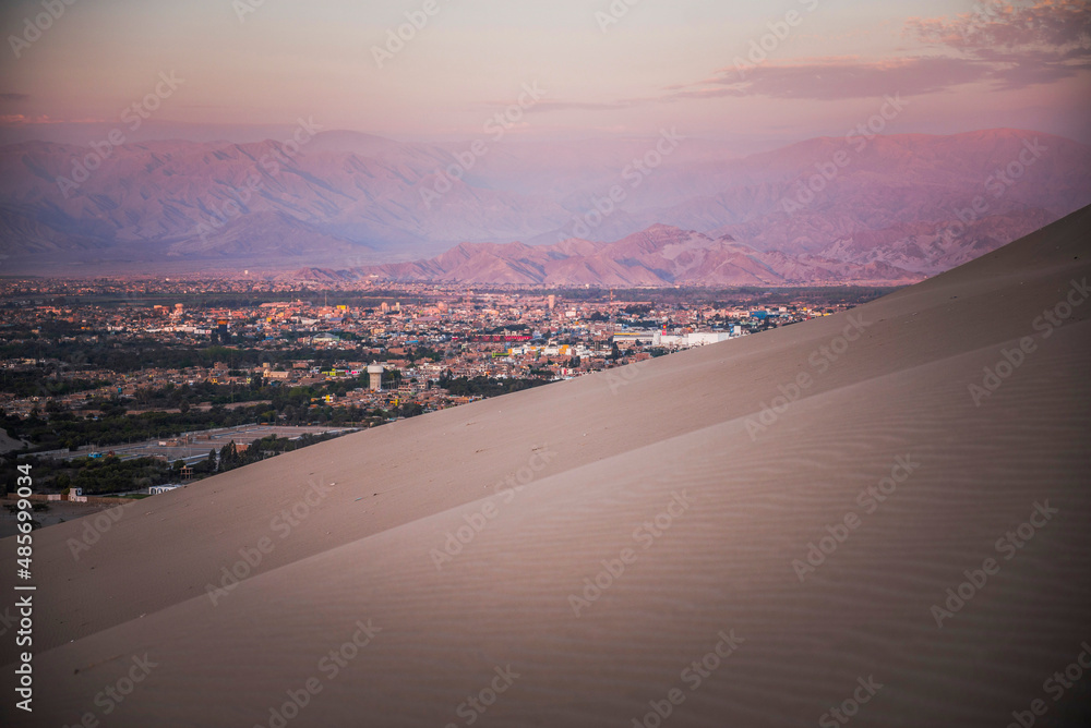 Ica at sunset, seen from sand dunes at Huacachina, Ica Region, Peru, South America