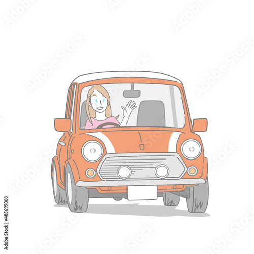 クラシックカーで運転を楽しむ女性