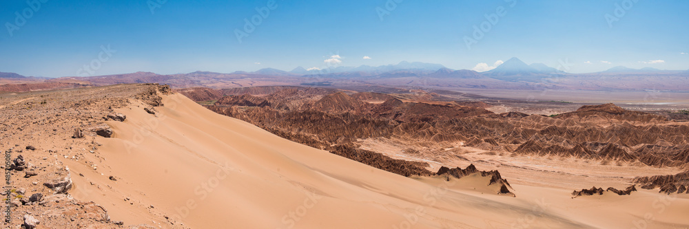 Naklejka premium Death Valley (Valle de la Muerte) sand dune and rock formations, with Licancabur Volcano behind, San Pedro de Atacama, Atacama Desert, North Chile, South America