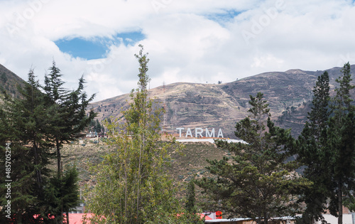 City of tarma located in the department of Junin, Peru. Tarma sign on the hills around the city photo