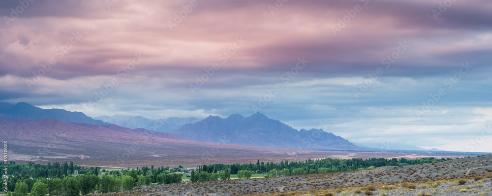 Fototapeta premium Andes Mountains landscape with dramatic clouds at sunset, Uspallata, Mendoza Province, Argentina, South America, background with copy space