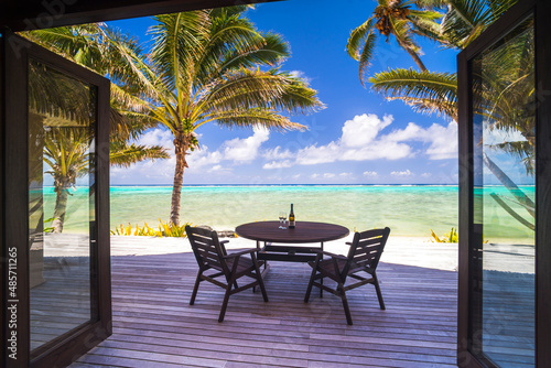 Фотография Luxury beachfront villa accommodation with sea views, with champagne on a table