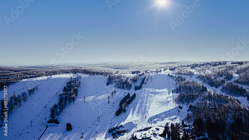 Aerial snow covered ski slope mountains seven springs