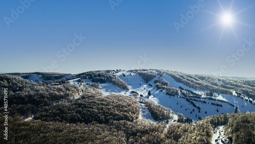 snow covered ski slope mountains in the winter