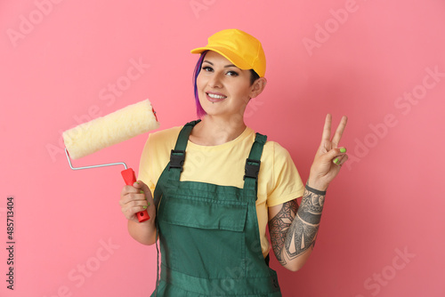 Female painter in cap with ...