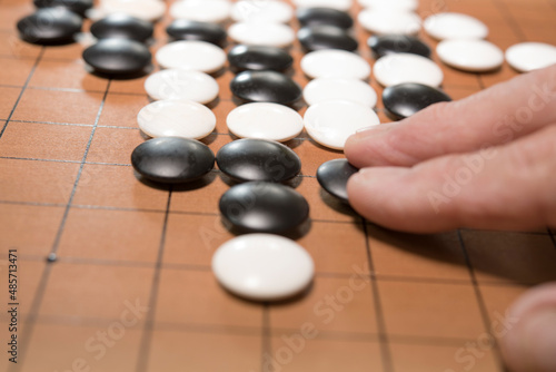 hand playing go game