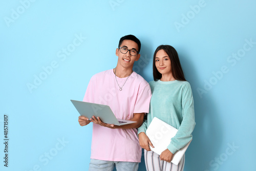 Young couple with laptops o...