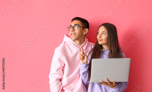 Young couple with laptop on...