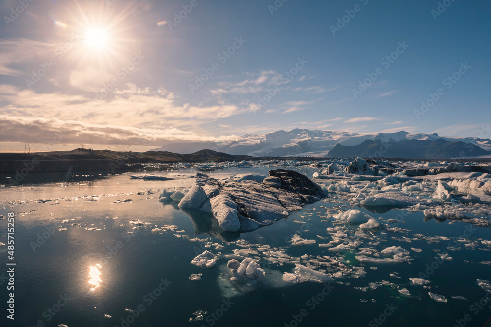 Icebergs in Jokulsarlon Glacier Lagoon, melting due to global warming and climate change, Vatnajokull Ice Cap behind, South East Iceland, Europe