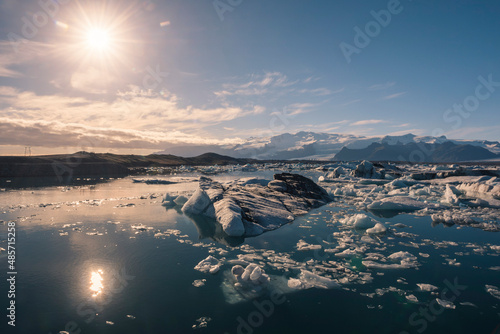 Icebergs in Jokulsarlon Glacier Lagoon, melting due to global warming and climate change, Vatnajokull Ice Cap behind, South East Iceland, Europe