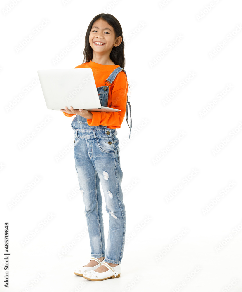 Cutout isolated studio shot of Asian young cute girl in casual orange party costume standing holding hand up say hi greeting on video call via laptop computer on white background. Cutout isolated studio shot of Asian young cute girl in casual orange party costume standing holding hand up say hi greeting on video call via laptop computer on white background.