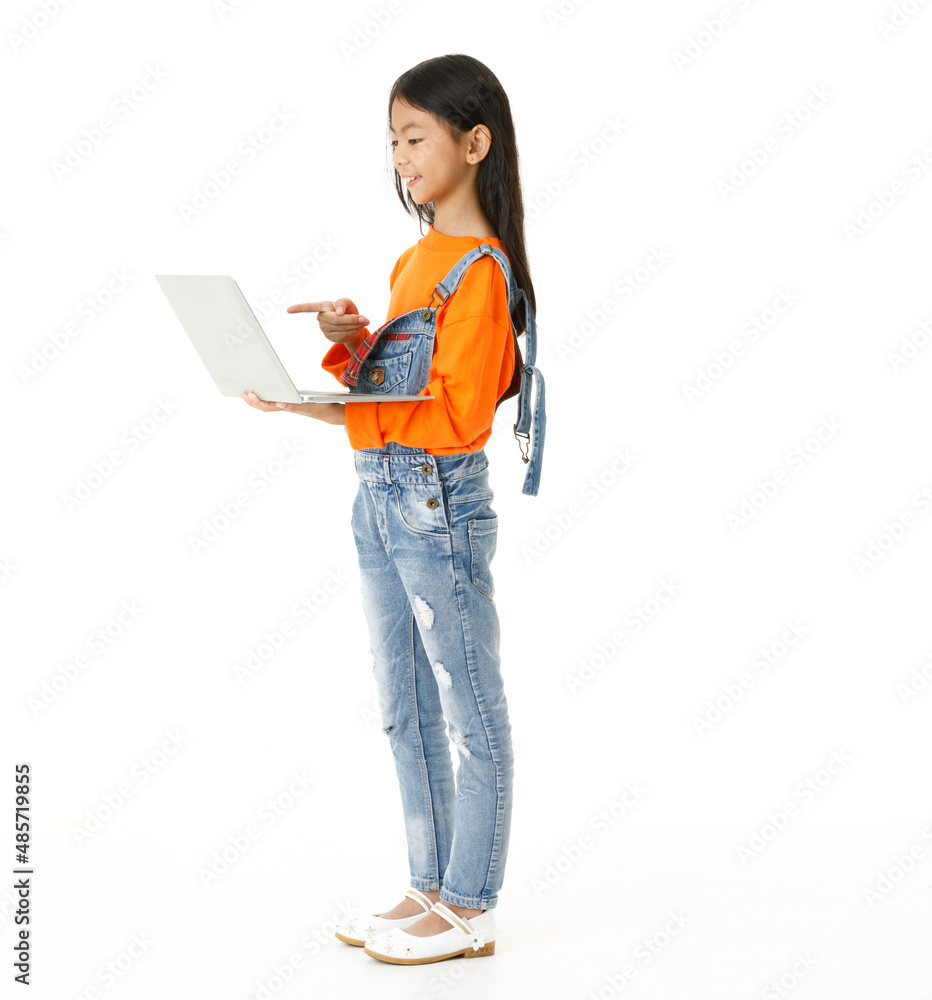 Cutout isolated studio shot of Asian young cute girl in casual orange party costume standing holding hand up say hi greeting on video call via laptop computer on white background. Cutout isolated studio shot of Asian young cute girl in casual orange party costume standing holding hand up say hi greeting on video call via laptop computer on white background.