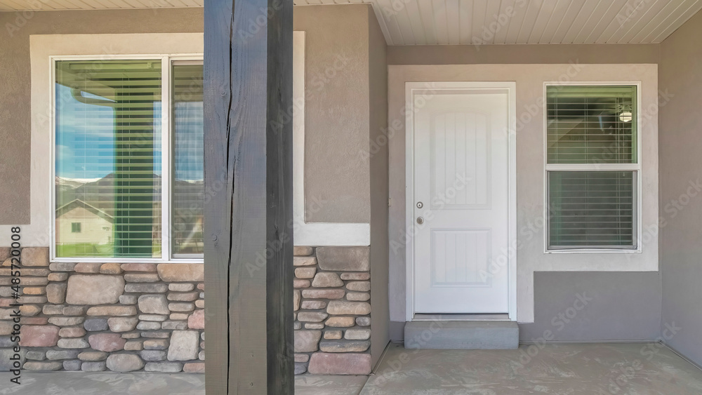 Panorama Front door exterior of a house with gray and white color palette Panorama Front door exterior of a house with gray and white color palette