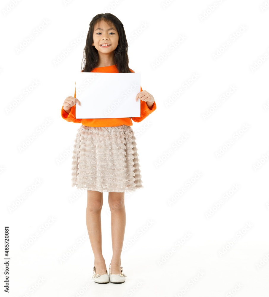 Portrait full body cutout isolated studio shot of Asian young happy primary schoolgirl model in casual outfit standing holding advertising placard paper board for text copy space on white background Portrait full body cutout isolated studio shot of Asian young happy primary schoolgirl model in casual outfit standing holding advertising placard paper board for text copy space on white background