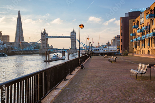 Tower Bridge and the Shard at sunset, seen behind the River Thames, Tower Hamlets, London, England photo