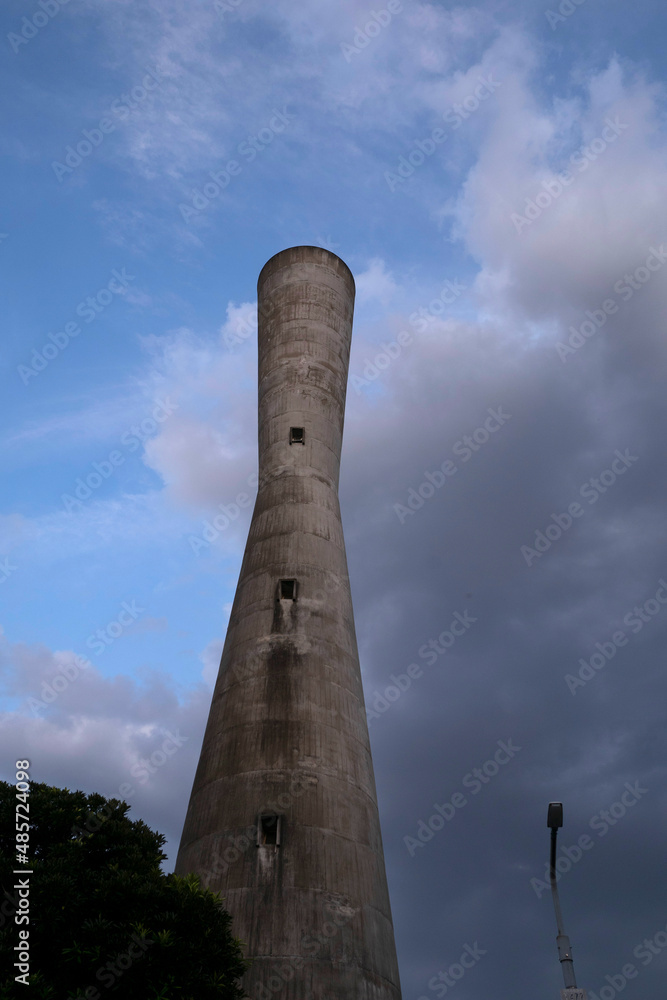 A concrete water tower in the sky