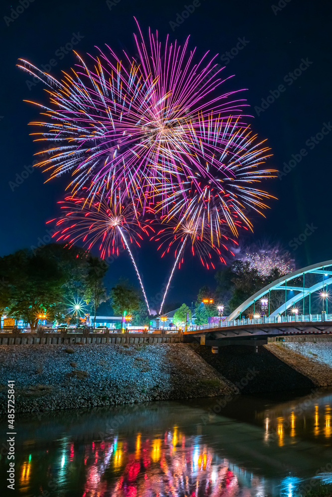 Beautiful Fireworks and light Chan Palace Bridge over the Nan River New Landmark It is a major tourist is Public places attraction Phitsanulok,Thailand,Twilight sunset.