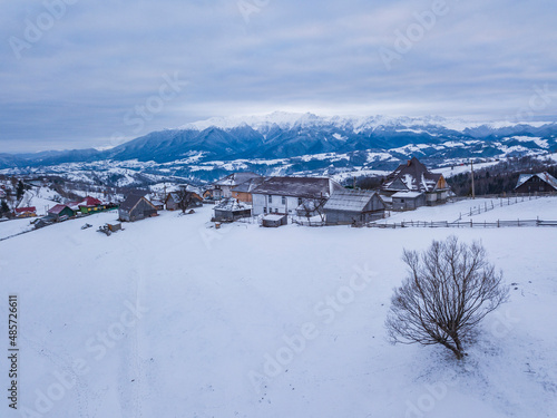 Snowy winter landscape in the Carpathian Mountains, Bran, Transylvania, Romania drone