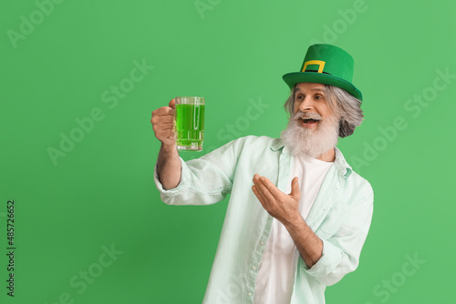 Senior man in hat with glas...