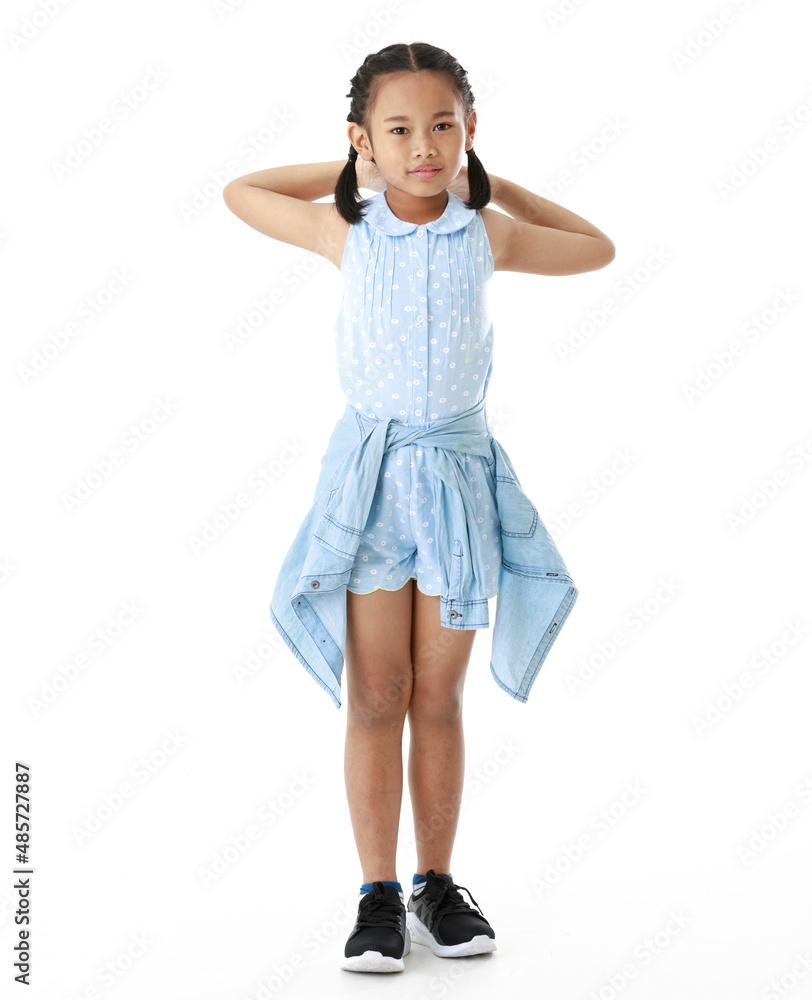 Portrait full body studio cutout shot of Asian young happy cheerful pigtail braid hairstyle elementary school girl in blue sleeveless dress standing posing smiling look at camera on white background Portrait full body studio cutout shot of Asian young happy cheerful pigtail braid hairstyle elementary school girl in blue sleeveless dress standing posing smiling look at camera on white background