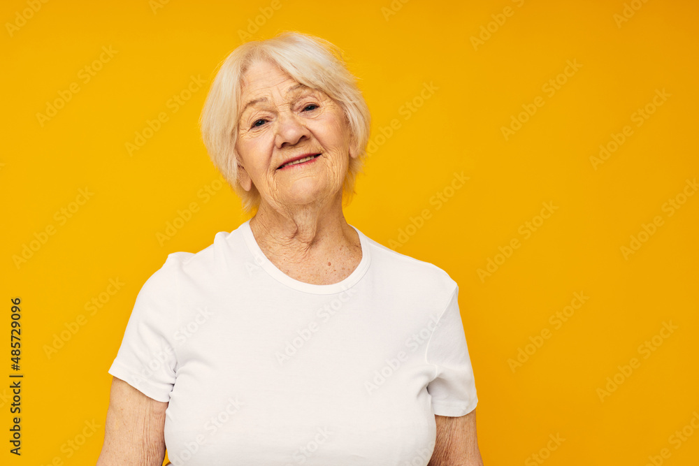 Portrait of an old friendly woman happy lifestyle joy isolated background Portrait of an old friendly woman happy lifestyle joy isolated background