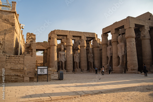 Columns and statues in the courtyard of Ramses II of the Luxor Temple. Luxor (destroyed Thebes). Egypt.