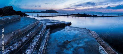 Guernsey Bathing Pools and Castle Cornet at sunrise, Channel Islands, United Kingdom photo