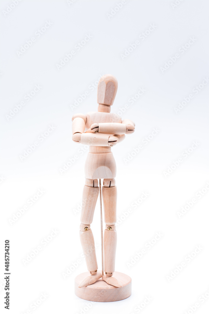 Isolated of wooden figure doll posing on white background - leader with confident concept Isolated of wooden figure doll posing on white background - leader with confident concept