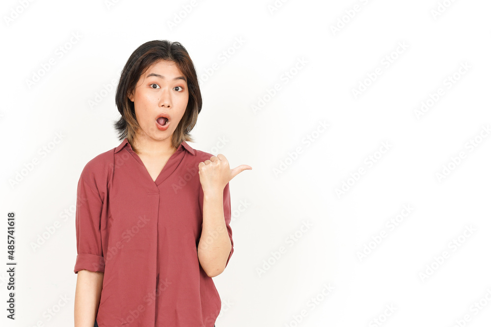Showing Product and Pointing Side Using Thumb Of Beautiful Asian Woman Isolated On White Background Showing Product and Pointing Side Using Thumb Of Beautiful Asian Woman Isolated On White Background
