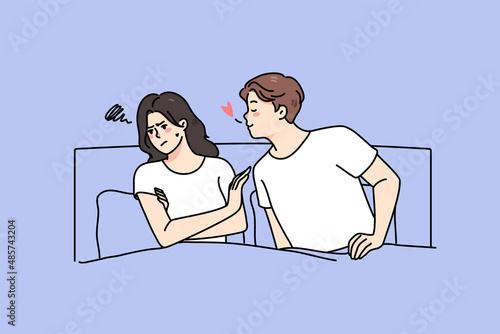 Loving man lying in bed with ignorant woman show affection and care. Young couple relationships problem concept. Husband and wife have relations troubles. Breakup or divorce. Vector illustration. 