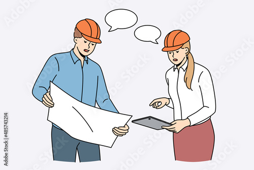 Construction engineers and workers concept. Young woman and man workers engineers teammates in helmets standing and discussing plan of blueprints construction vector illustration 