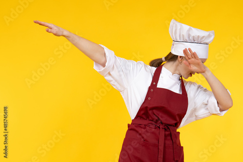Cheerful chef. Woman makes ...