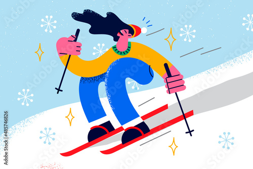 Happy girl skiing on winter holidays in mountains 