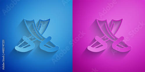 Paper cut Crossed pirate swords icon isolated on blue and purple background. Sabre sign. Paper art style. Vector