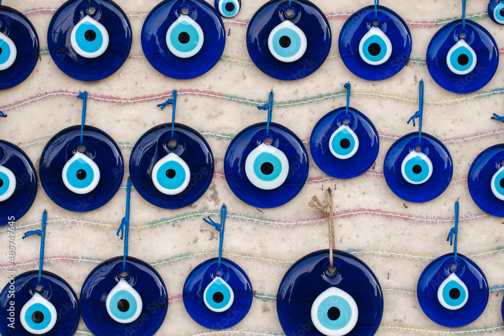 Fototapeta premium Nazar bonjuk, bead from evil eye, an amulet of Fatima's blue eye, souvenir hanging lot are sold on market.
