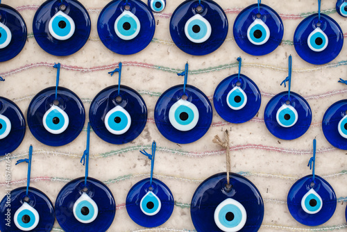 Nazar bonjuk, bead from evil eye, an amulet of Fatima's blue eye, souvenir hanging lot are sold on market. photo