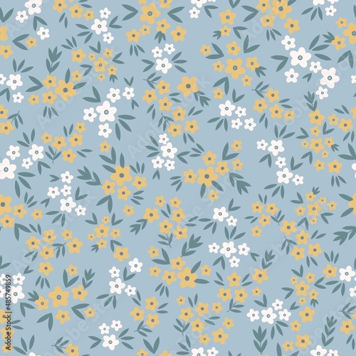 Seamless vintage pattern. Small yellow and white flowers. blue leaves. Light blue background. vector texture. fashionable print for textiles, wallpaper and packaging.