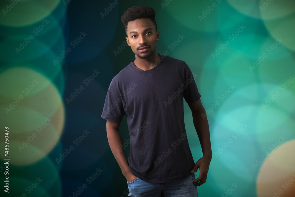 Φωτογραφία young african man twenties jeans and t-shirt on green background