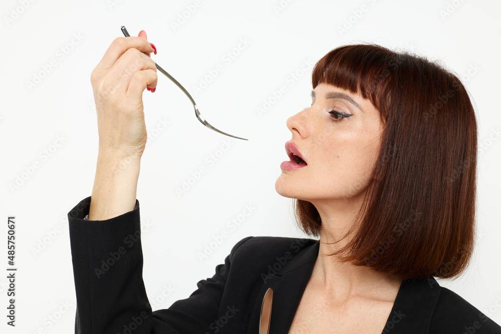 attractive woman knife and fork in hands emotions posing Lifestyle unaltered attractive woman knife and fork in hands emotions posing Lifestyle unaltered