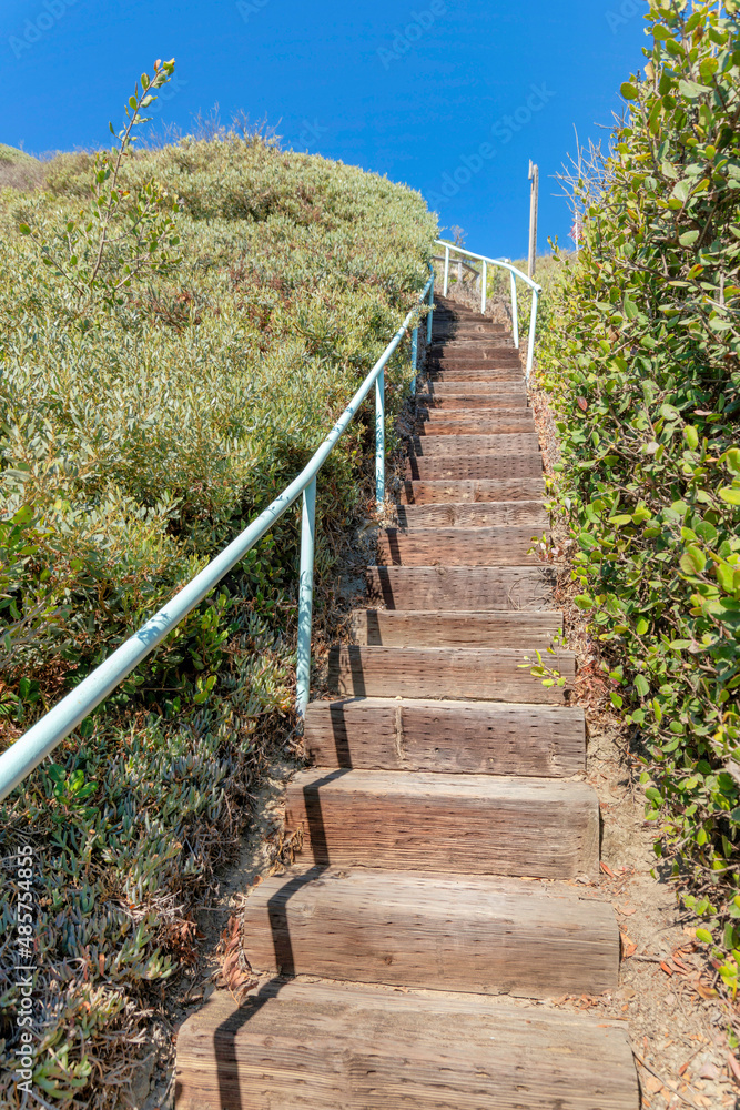 Uphill trail with wooden steps at San Clemente, California