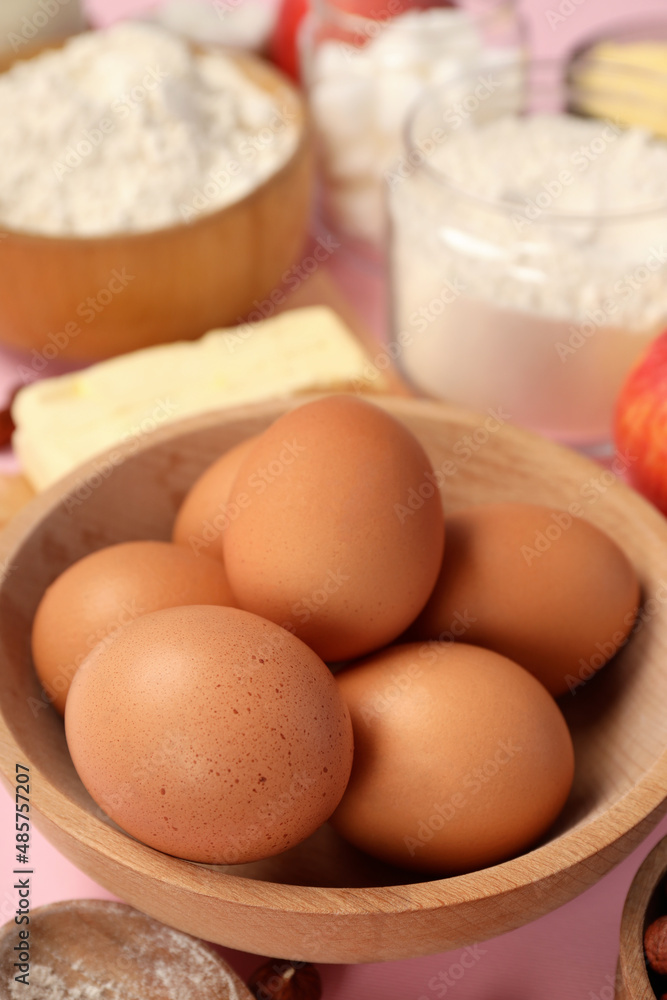 Ingredients for pie or cake cooking on pink background Ingredients for pie or cake cooking on pink background
